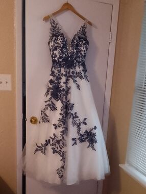 White Maxi Dress with Black Floral Appliqué - Elegant V-Neck